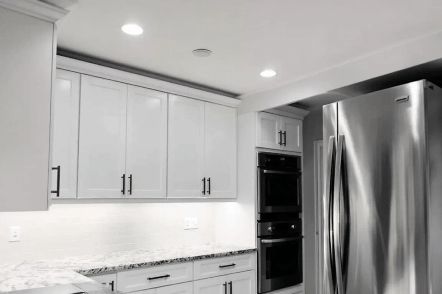 The Image Showcases A Modern Kitchen Transformation Featuring Sleek Cabinet Pulls And Stylish Light Fixtures, Highlighting The Impact Of Home Improvements On The Overall Aesthetic. Such Updates Can Significantly Enhance A Home'S Curb Appeal And Attract Potential Buyers, Making It More Appealing In The Competitive Real Estate Market.